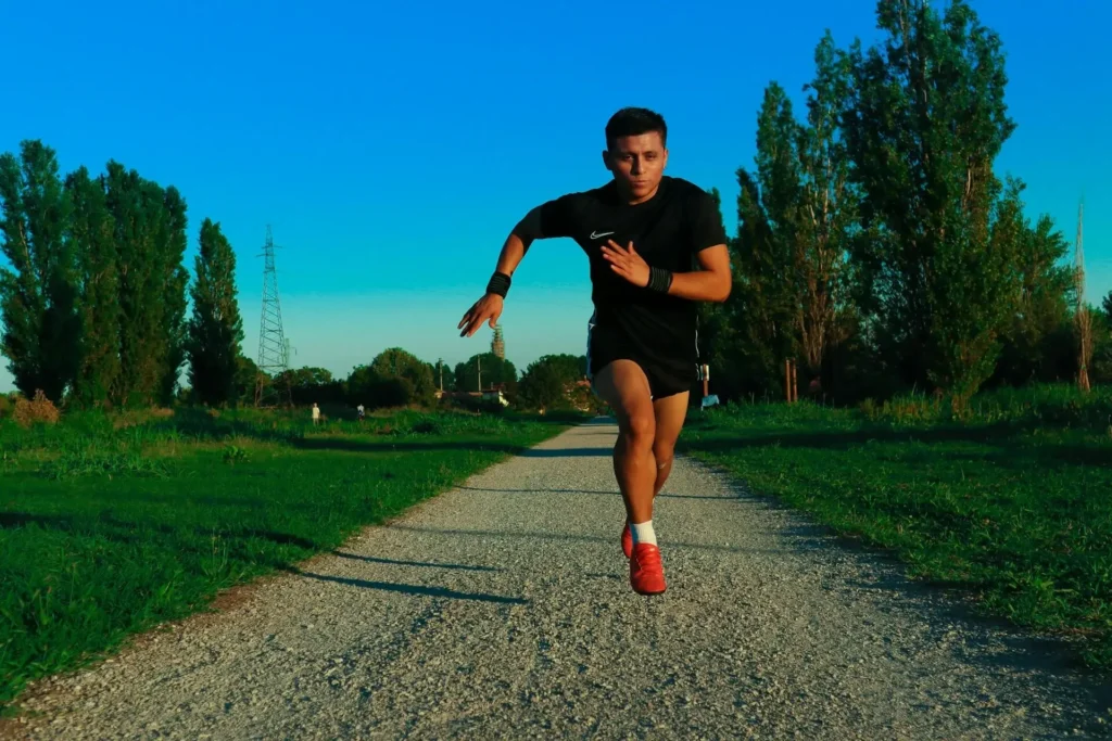 stretching and exercising outdoors to prepare for an adventure trip